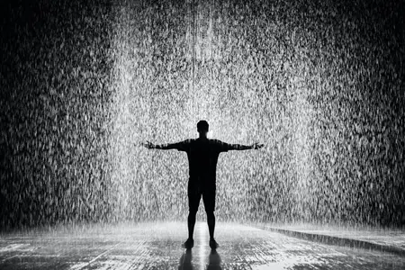 A man standing in the rain.