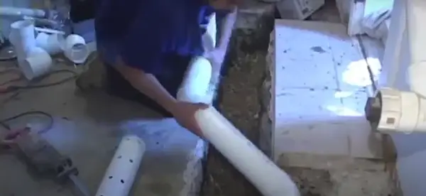 Placing round PVC drain tile pipe in the basment